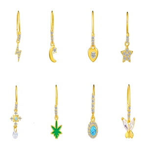 Gold nose ring collection with sparkling heart, star, and butterfly crystal pendants