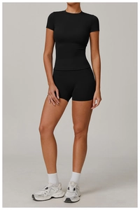 Side view of black high-stretch brushed yoga set featuring slim-fit top and sports shorts