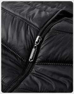 Detailed close-up of a high-quality metal zipper with SPORT engraving on black quilted vest