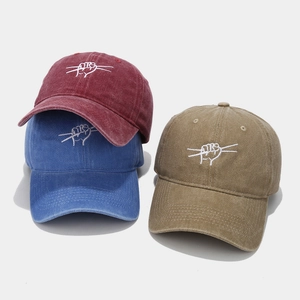 Washed cotton baseball caps in burgundy, blue and khaki with hip-hop style embroidery