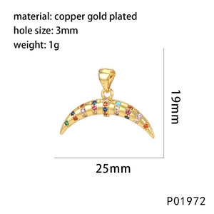 Macro view of gold-plated crescent moon pendant with colored zircons and size markings