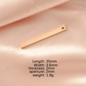 Polished rose gold vertical bar pendant on pink satin with detailed size parameters