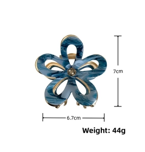 Blue marble acetate flower hair claw with amber gem and metal teeth detail, 7cm x 6.7cm