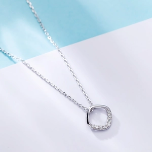 Macro view of S925 sterling silver square pendant with micro-set zircon crystals