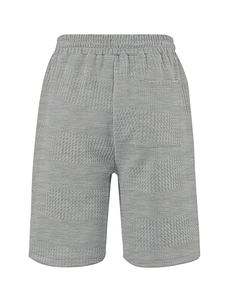 Detailed macro view of light grey waffle knit fabric and elastic drawstring waistband