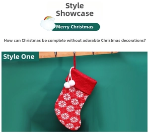 Detail of red knit Christmas stocking with white snowflake patterns and fuzzy pompoms