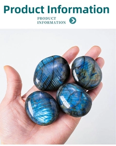 Detailed close-up of natural labradorite palm stones with blue and green flash flash