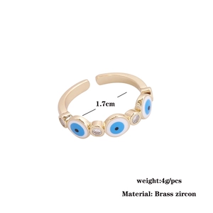 Close-up of a brass copper devil eye ring with blue zircon inlay and 1.7cm inner diameter