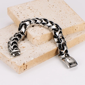 Industrial style stainless steel link bracelet with geometric nodes and folding clasp