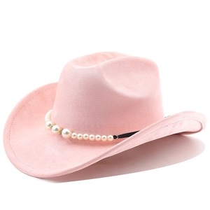 Detail of pink suede cowboy hat featuring pearl bead band and wide curved brim