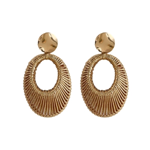 Golden woven hollow oval drop earrings with silver needle posts and metallic finish