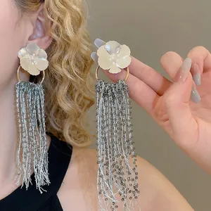 Exquisite flower stud earrings with long crystal bead tassels and golden ring details