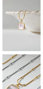 Detail of square heart necklace with white mother of pearl inlay in gold and silver