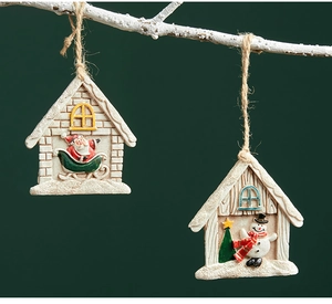 Christmas resin house ornaments with Santa and Snowman hanging on white branches
