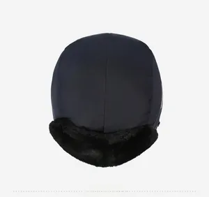 Detail view of winter trapper hat showing thick faux fur lining and windproof fabric