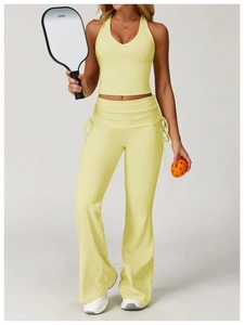 Close-up of light yellow yoga vest and flared pants with drawstring for pickleball sport