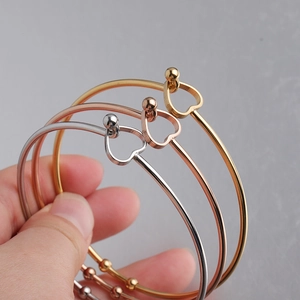 Detailed view of 2mm open heart bracelets in gold, rose gold and silver finishes