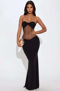Detail of sheer mesh patchwork and strapless design on a slim fit black evening dress