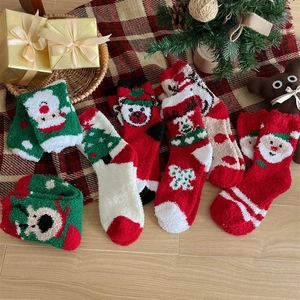 Thick coral fleece Christmas socks featuring cartoon reindeer and Santa patterns