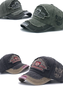 Detail of vintage washed baseball cap with distressed embroidery and metal buckle