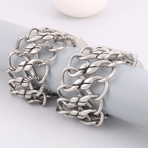 Close-up of vintage silver braided mesh bracelet featuring bold industrial chain links