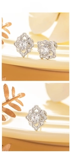Macro shot of vintage floral stud earrings featuring cubic zirconia and intricate metalwork