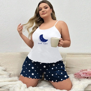 Detail of white camisole with Good Night moon print and star pattern pajama shorts