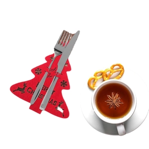 Red felt Christmas tree cutlery holder with Merry Christmas reindeer print for table decor