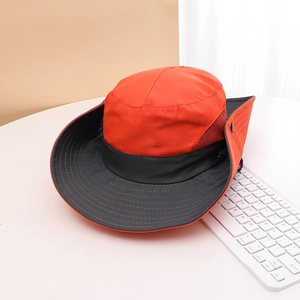 Detail of outdoor sun hat with orange-grey color blocking and breathable mesh side