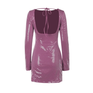 Detail of the backless sequin dress with deep U-shape and delicate tie closure