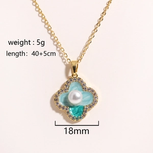 Detail shot of blue enamel clover pendant with pearl and small diamonds including size info