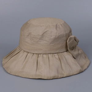 Detailed shot of breathable ramie sun hat featuring a wide brim and fabric bow decoration