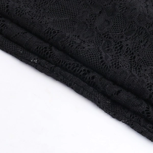 Close-up of intricate black lace floral pattern and delicate mesh texture details