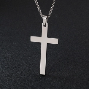 Polished stainless steel cross pendant with twisted rope chain on dark background
