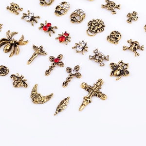 Vintage gothic alloy nail charms collection with skulls spiders and metal crosses