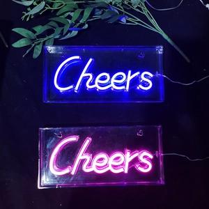 Dual Cheers LED neon signs in pink and blue light on acrylic backplates for festive decor