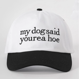Close-up of contrast stitching and embroidery 'my dog said' on cotton baseball cap