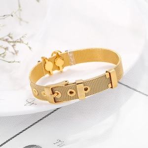 Detail of gold mesh strap bracelet with belt buckle clasp and twin key charms