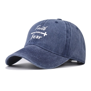 Washed navy cotton baseball cap featuring Faith OVER Fear cross print and metal buckle