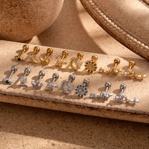 Macro shot of titanium steel helix earrings with zircon and colorful gemstones