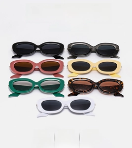 Collection of oval sunglasses in seven colors including black, green, and tortoiseshell