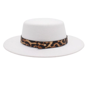 Detail of white wool boater hat featuring a stylish leopard print band and gold buckle
