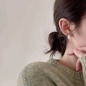 925 Sterling Silver Freshwater Pearl Hoop Earrings worn on model for a minimalist style