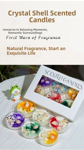 Set of six colorful seashell scented candles with glitter and pearls in a gift box