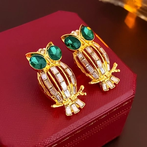 Vintage owl stud earrings in gold with green gemstone eyes and clear zircon crystals