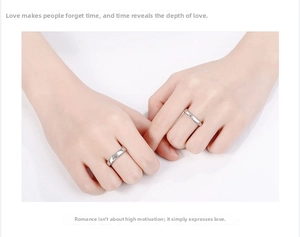 Close-up of minimalist silver couple rings with single stone inlay on fingers