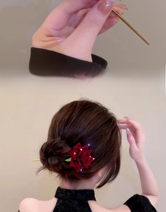 Detail of red rose hair pin with golden tassel and velvet petals for traditional hairstyle