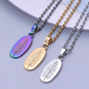 Three gold, silver, and iridescent stainless steel oval tree pendant necklaces set