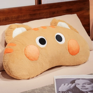 Detailed plush texture of a soft orange long cat pillow against a cozy home bedroom backdrop
