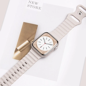 Detail of beige wave silicone sport band with silver buckle for Apple Watch Ultra
